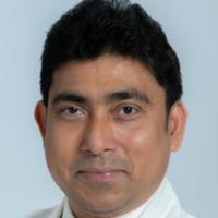 Portrait image of Dr. Partha Sardar in his white lab coat